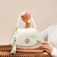 Embroidery_Leather_Vintage_White_Lotus_Handbag_with_Pendant_-_SinoCultural-2476532