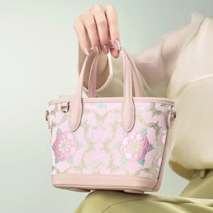 model-seated-carrying-brocade-bag-on-knees