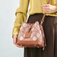 model-wearing-brocade-bucket-bag-crossbody