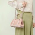 song-brocade-pink-dingsheng-crossbody-bag-model-green-dress-shoulder