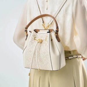 wanj-pattern-embroidered-leather-convertible-backpack-tote-model-wearing-backpack-from-behind